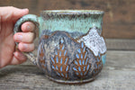 Load image into Gallery viewer, Cabin in Lupine Fields and Glacial Lake Sunset Carved Mug, 19 oz
