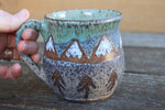 Load image into Gallery viewer, Distant Snowy Peaks River Sunset Mug, 15 oz
