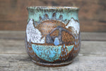 Load image into Gallery viewer, Cabin in Lupine Fields and Glacial Lake Sunset Carved Mug, 19 oz
