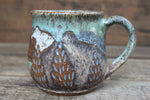 Load image into Gallery viewer, Cabin in Lupine Fields and Glacial Lake Sunset Carved Mug, 19 oz
