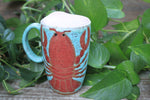 Load image into Gallery viewer, Lobster Lovers Handled Travel Mug, Red Lobster with Pink, Yellow, Purple and White Buoys - 16 oz
