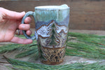 Load image into Gallery viewer, Distant Mountain and Evergreen Days Carved Handled Travel Mug, 19 oz
