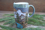 Load image into Gallery viewer, Distant Mountain and Evergreen Days Carved Handled Travel Mug, 19 oz
