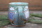 Load image into Gallery viewer, Tulip Fields and Partly Cloudy Skies Carved Mug, 16 oz
