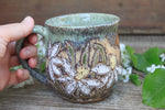 Load image into Gallery viewer, Daffodil Fields and Mountain Lake Carved Mug, 18 oz
