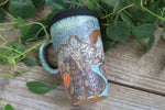 Load image into Gallery viewer, Glacial River and Wildflower Fields Carved Travel Mug, 18 oz

