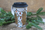 Load image into Gallery viewer, Twinkly Lights and Large Evergreens Handled Travel Mug, 17 oz
