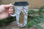 Load image into Gallery viewer, Twinkly Lights and Large Evergreens Handled Travel Mug, 17 oz
