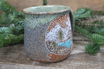 Load image into Gallery viewer, Distant Mountain Snow Globe Dreams Carved Mug, 16 oz
