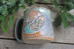 Load image into Gallery viewer, Distant Mountain Snow Globe Dreams Carved Mug, 16 oz
