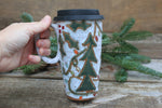 Load image into Gallery viewer, Twinkly Lights, Holly and Evergreens Handled Travel Mug, 19 oz
