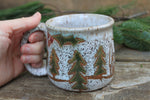Load image into Gallery viewer, Snowy Cabin in Evergreen and Holly Grove Mug, 15 oz
