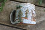 Load image into Gallery viewer, Snowy Cabin in Evergreen and Holly Grove Mug, 15 oz
