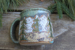 Load image into Gallery viewer, Snowy Cabin, Evergreens and Rolling River Mug, 19 oz
