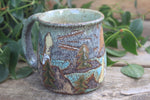 Load image into Gallery viewer, Acadia National Park Coastal Cliffs and Sailboat Mug, 19 oz
