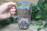 Load image into Gallery viewer, Glacial River and Coneflower Fields Carved Travel Mug, 18 oz
