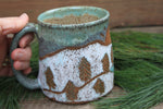 Load image into Gallery viewer, Snowy Cabin Forest and Glacial Lake Sunset Carved Mug, 19 oz
