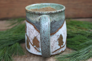 Snowy Cabin Forest and Glacial Lake Sunset Carved Mug, 19 oz