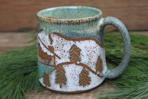 Snowy Cabin Forest and Glacial Lake Sunset Carved Mug, 19 oz