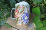 Load image into Gallery viewer, Delightful Dahlias Carved Handled Travel Mug, Crimson and Purple, 15 oz
