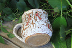 Load image into Gallery viewer, Snowy Cabin with Cardinals in a Birch Forest Mug, 18 oz
